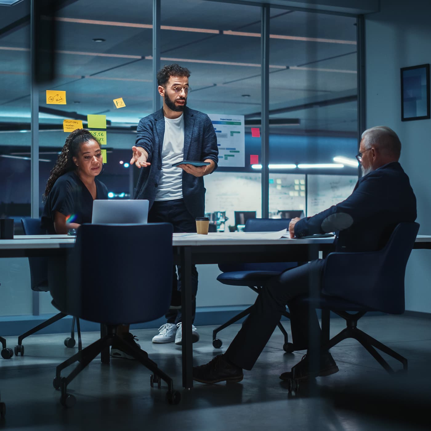 A diverse Team of Strategic Advisors in a office conference room, planning a mobility strategy for a customer. A diverse Team of Strategic Advisors in a office conference room, planning a mobility strategy for a customer.
