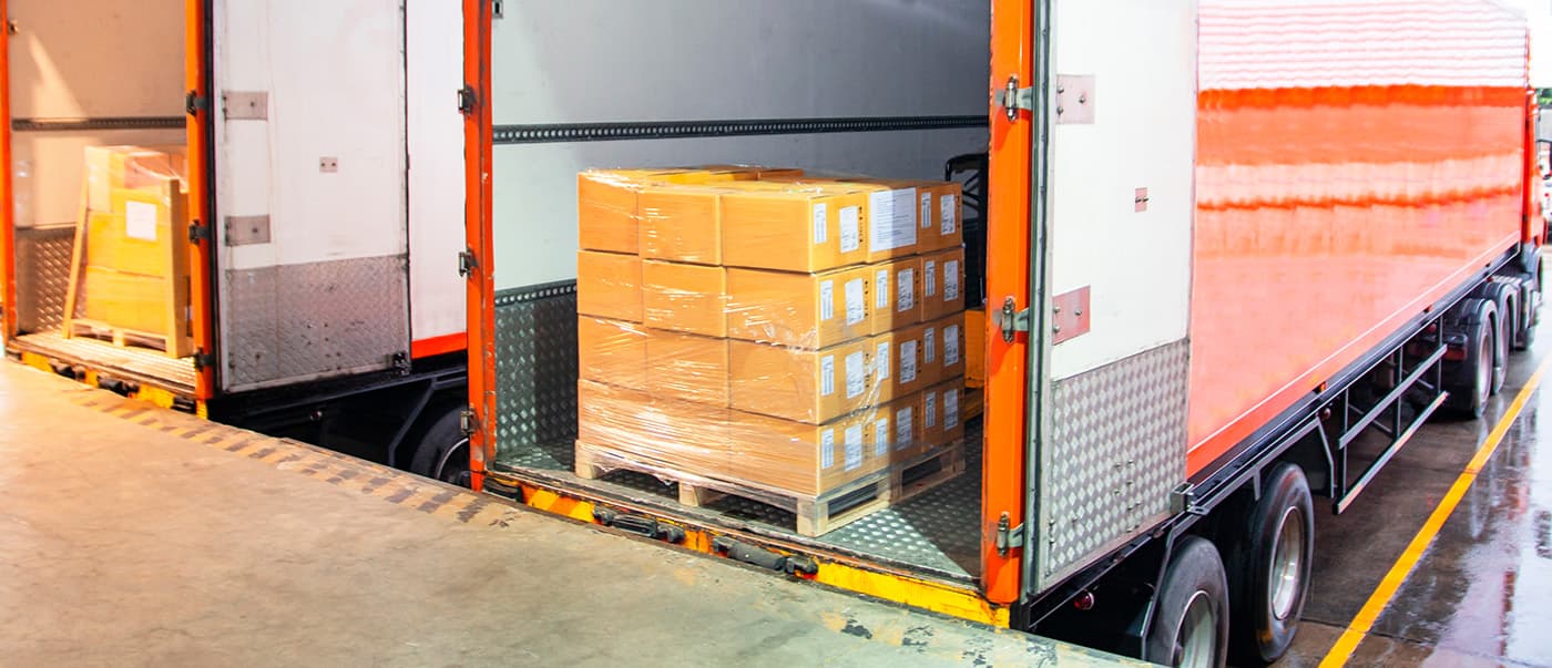 Last mile delivery of goods being loaded into a truck. Last mile delivery of goods being loaded into a truck.