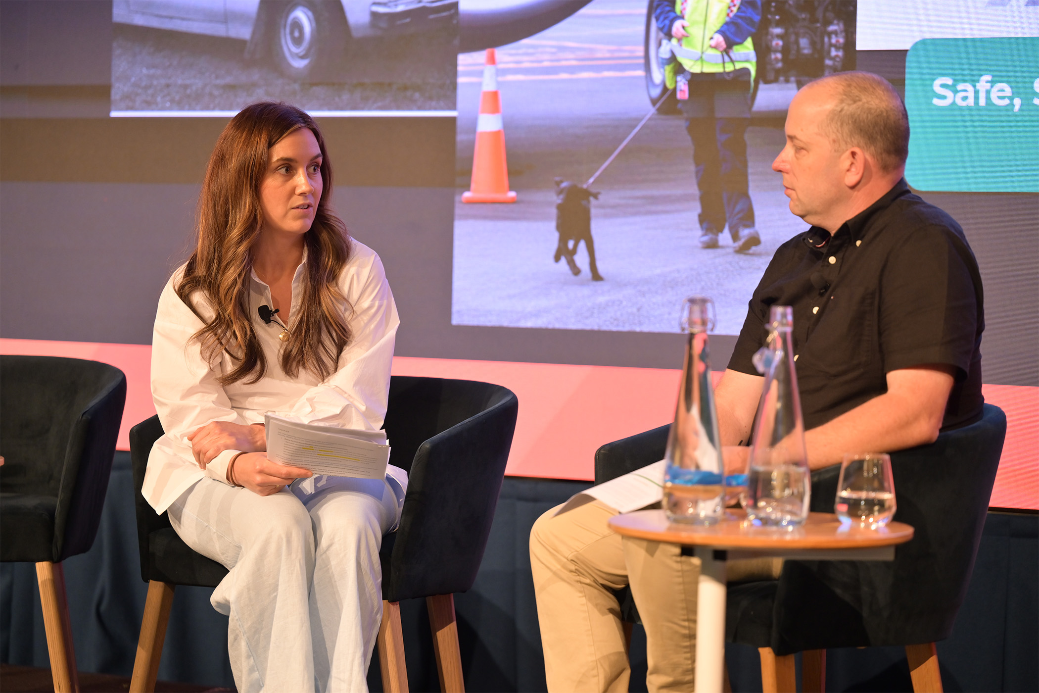 A photo of Caitlin Duggan from Custom Fleet and Lance McGhie from Civil Aviation Authority of New Zealand during their keynote discussion at the 2025 Sustainability Leadership Summit.