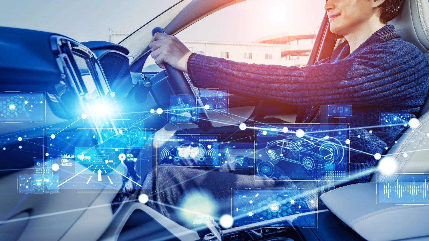The hero image shows a mixed media illustration of male driver driving a car overlaid with digital technology concepts that depict advanced driver-assistance systems, such as telematics and AI automation.